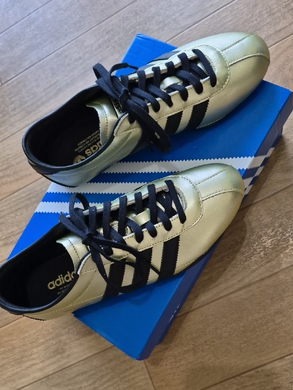 Adidas Metallic Gold Sneakers with Black Stripes